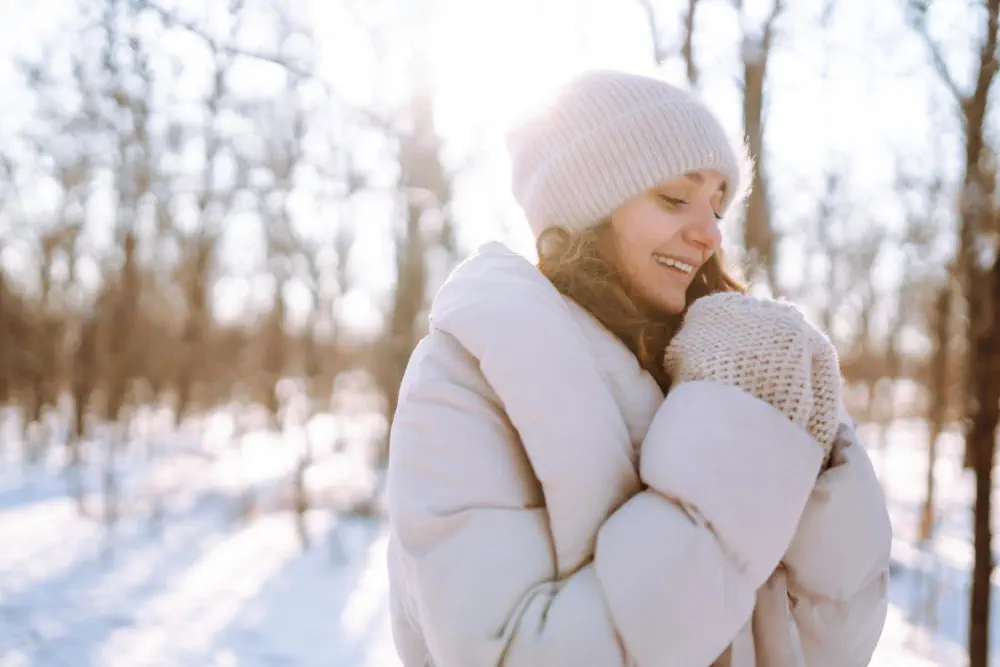 Woman smiling in snow.